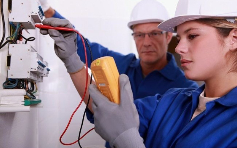 Electrical technician testing the system